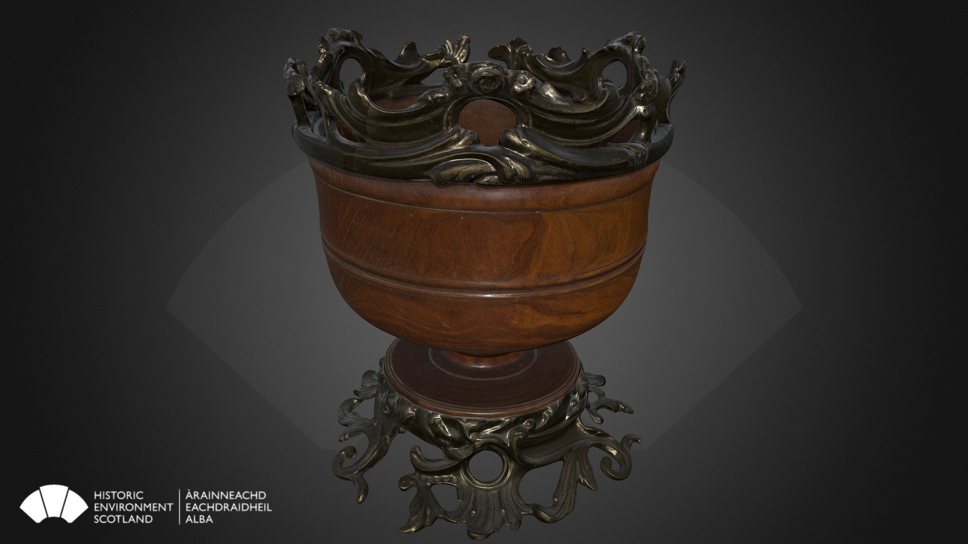 This is a turned wassail bowl with decorations from Duff House.

The ancient New Year practice of ‘wassailing’ was practiced in England, Scotland and Wales. Parties progressed from house to house with greetings for the health and prosperity of the inhabitants, which were acknowledged by communal drinking out of a Wassail bowl.

Although the drink differed from region to region, it usually contained a mixture of spiced ale, wine or cider. The term &lsquo;wassail' comes from the Anglo-Saxon &lsquo;waes-hael', which was the equivalent of the drinking toast &lsquo;good health' today. 

Wassail bowls can be ceramic or wood. Some are very elaborate, like this example in the Dunimarle Collection. The weight of this bowl and decorations on the rim may indicate that it had more of a decorative function. 

For information on visiting Duff House, go to our website.

h 279.4mm

RAE Project | DC334 - Wassail Bowl, Duff House - 3D model by Historic Environment Scotland (@HistoricEnvironmentScotland) 3d model